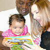 Parents, baby, and book