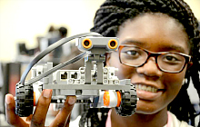 Maker Hub - youth holding robot