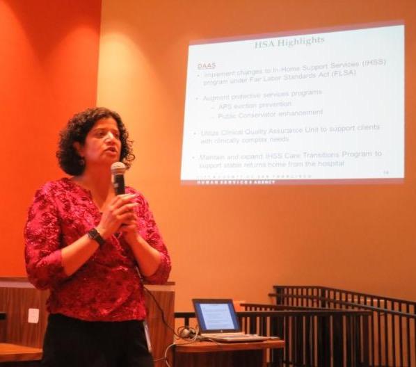 Shireen McSpadden talking with a  powerpoint behind