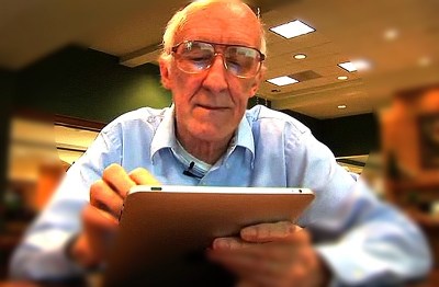 older man with computer tablet