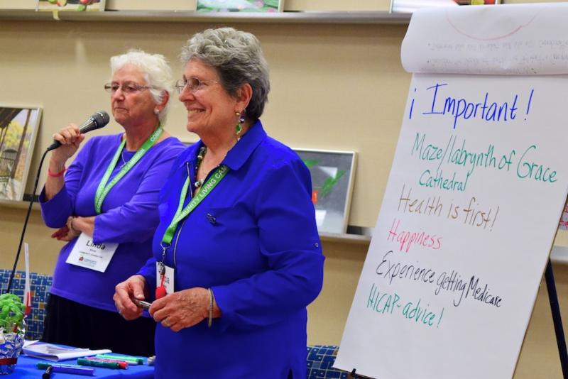 Workshop leaders with Important items on easel pad
