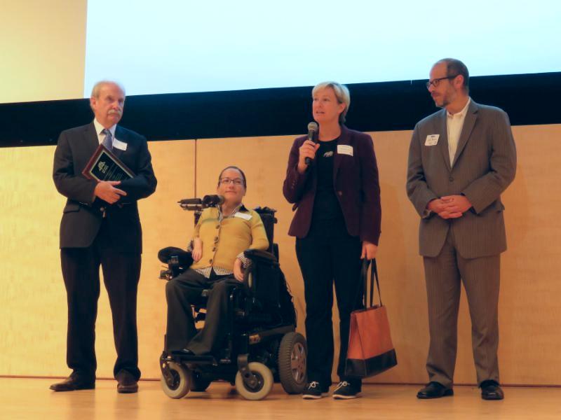4 people receiving an award for Free Muni