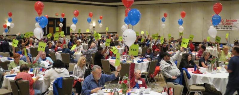 picture of seniors at the CARA Convention holding up Yes signs