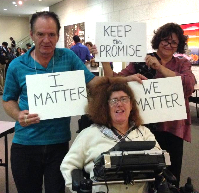 people with signs that say I matter, We Matter, Keep the Promise