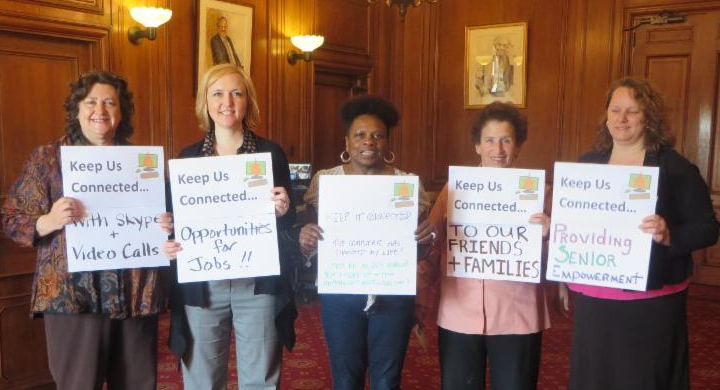 5 people with keep us connected signs