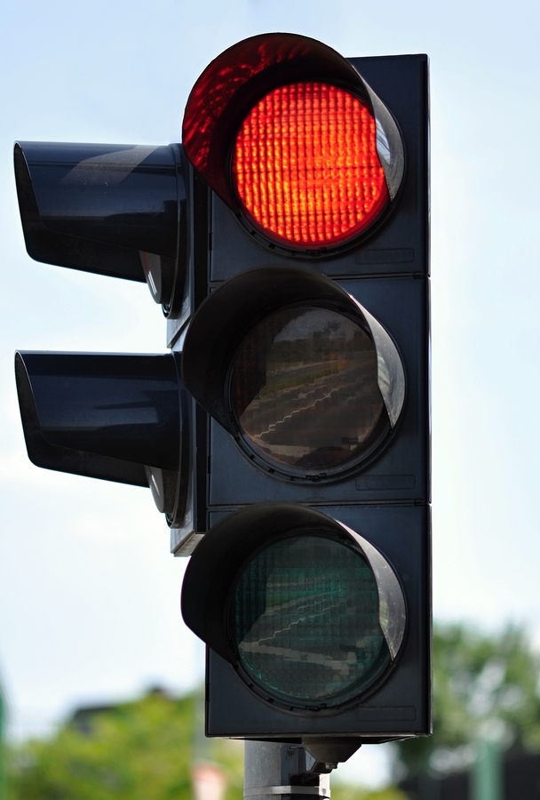 Traffic light with red light lit blurred background