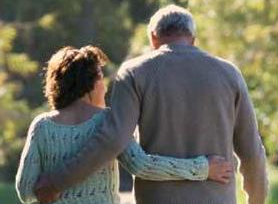 Couple walking arm-in-arm
