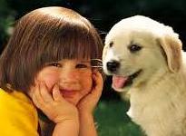 Close-up of kid & puppy