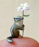 Wee chipmunk with daisy umbrella