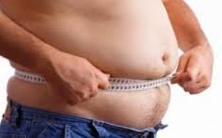Overweight man with a tape measure