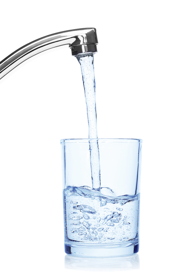 Glass filled with drinking water from tap, isolated on the white background, clipping path included.