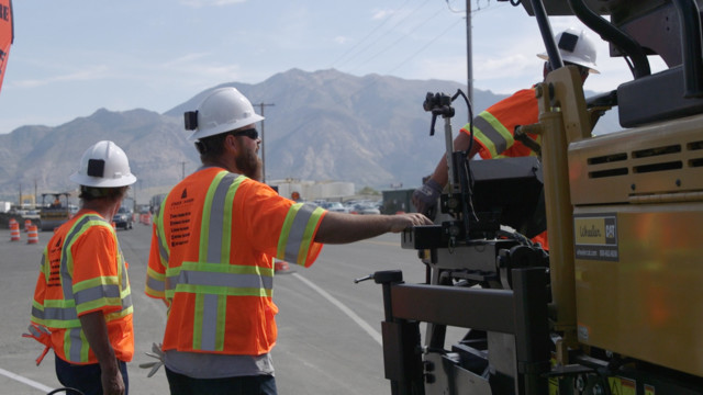 Workers on paving job site