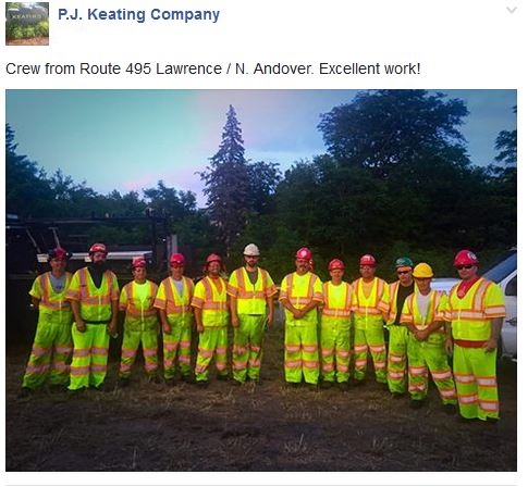Paving crew in hardhats and uniforms