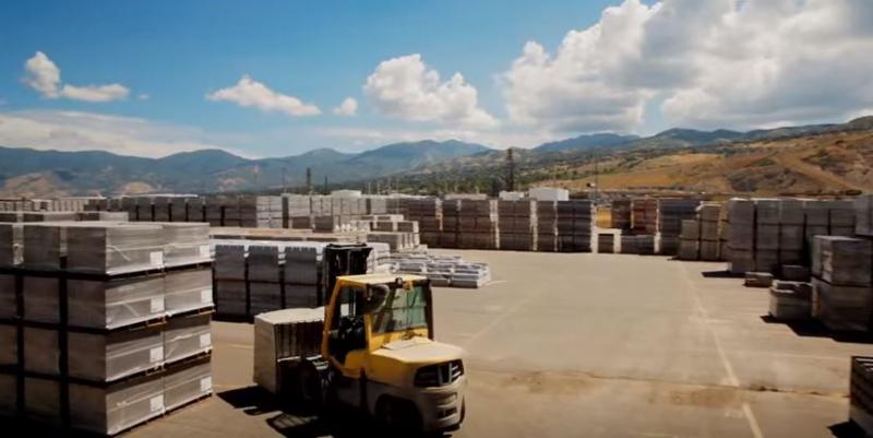 Stacking inventory outside with mountains in the background