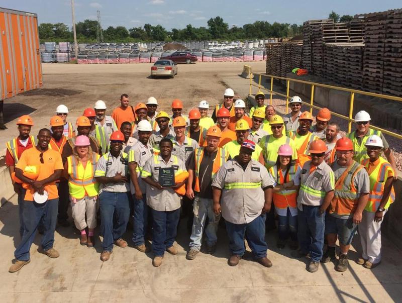 Employees holding safety award