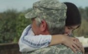 soldier hugging daughter