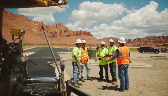 Employees working on a paving project