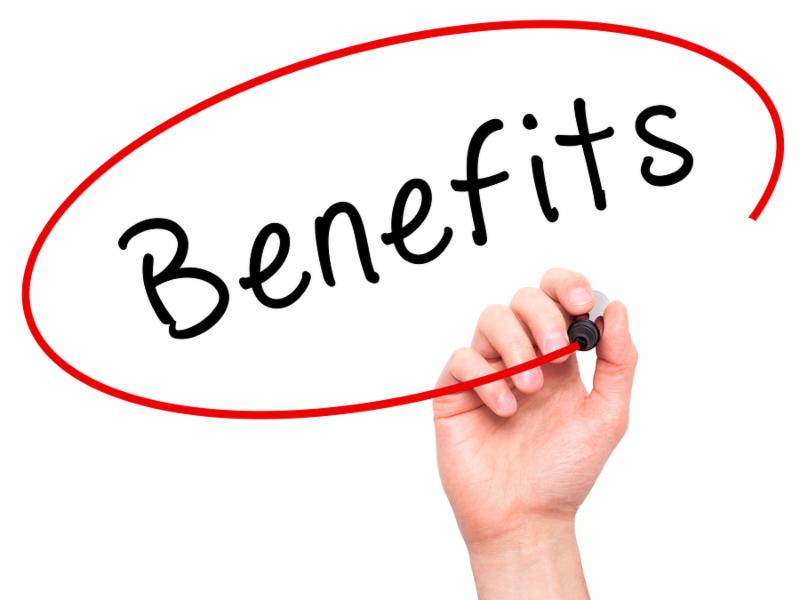Man Hand writing Benefits with marker on transparent wipe board. Business, internet, technology concept. Stock Photo