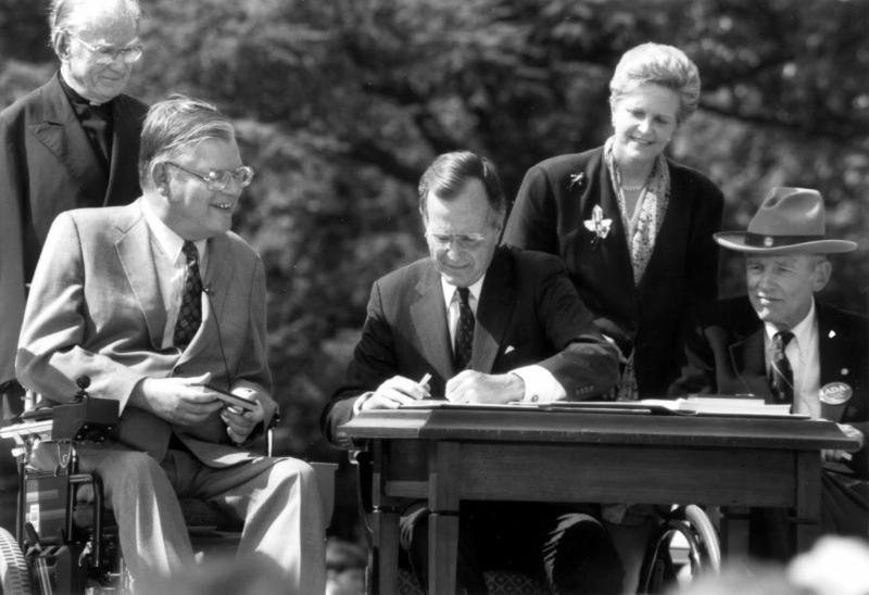 President George H.W. Bush and others at the signing of the Americans with Disabilities Act in 1990