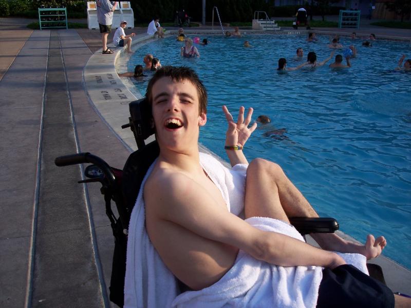 Nick smiling at the pool in Disney.