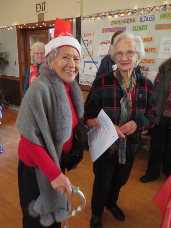 older woman looking cheery at event