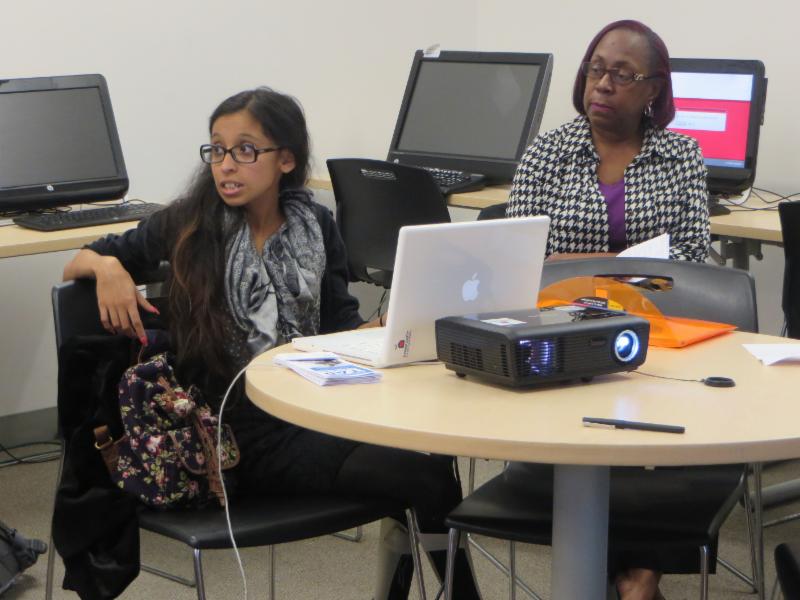 young woman leading computer presentation